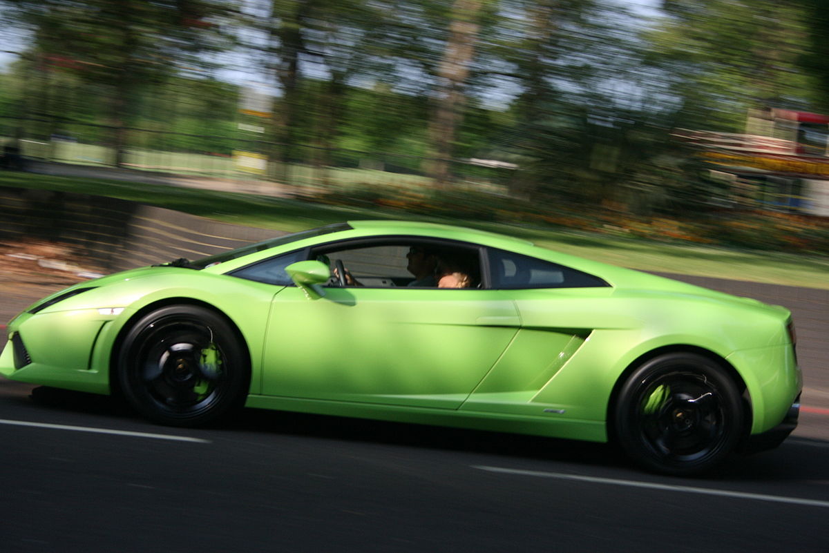 1200px-Lamborghini_Gallardo_racing_down_Park_Lane_-_Flickr_-_Supermac1961.jpg